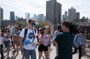 Otto and Milly being interviewed while crossing the Brooklyn Bridge for the Global Youth Climate Strike